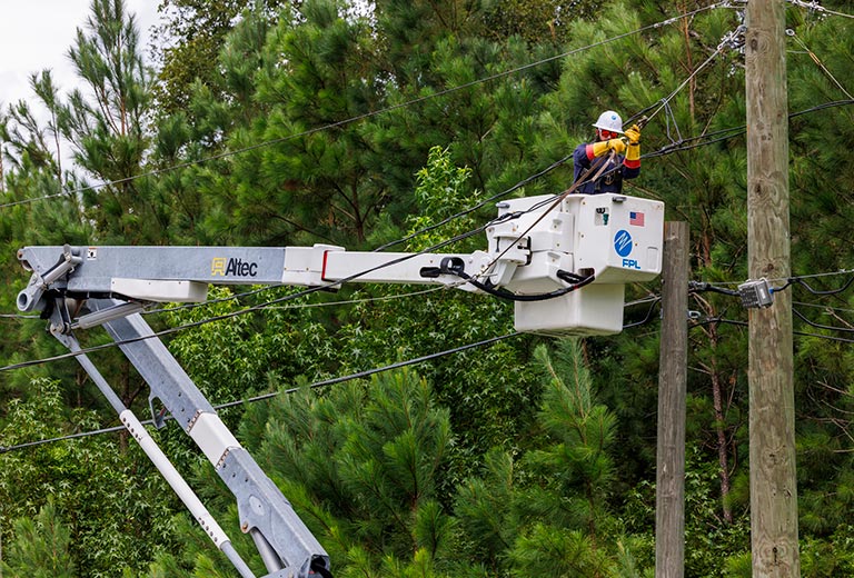 Worker restoring power.