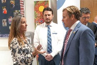 Commissioner Adkinson - US Representative Mike Haridopolis and Sean Williams converse during a tour of Pineapple Clove Classical Academy with Department of Education Secretary Linda McMahon