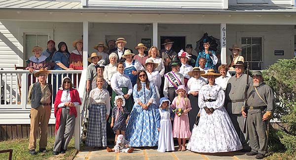 Pioneer Day players in front of Sams House