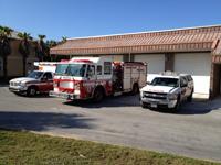 Fire truck, ambulance and fire rescue vehicle in front of Station 63