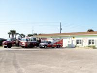Fire truck, ambulance and fire rescue vehicle in front of Station 64