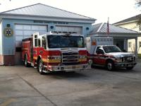 Fire truck and fire rescue vehicle in front of Station 83