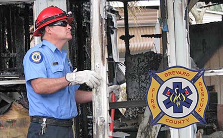 Inspector looking at fire damage.