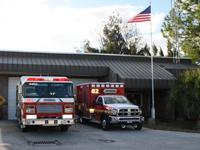 Fire truck and fire rescue vehicle in front of Station 82