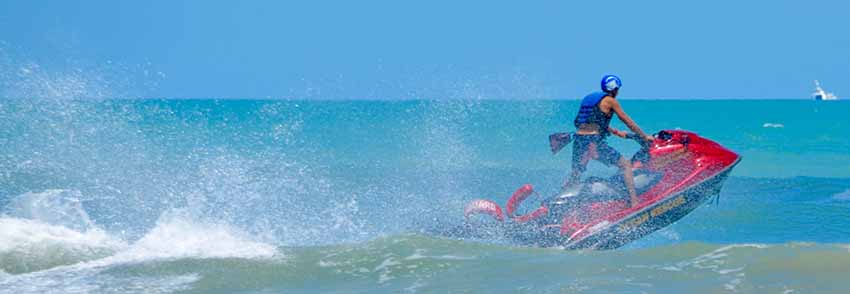 Ocean Rescue lifeguard driving a jet ski in the ocean in Cocoa Beach.