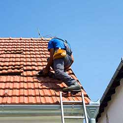 Man repairing roof.