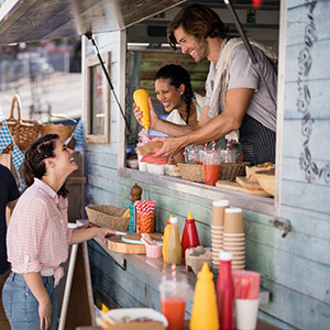 Woman getting food from food truck.