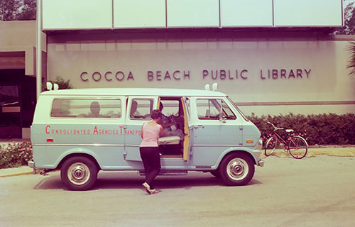 Front of the Cocoa Beach Public Library and people exiting a van in 1972.