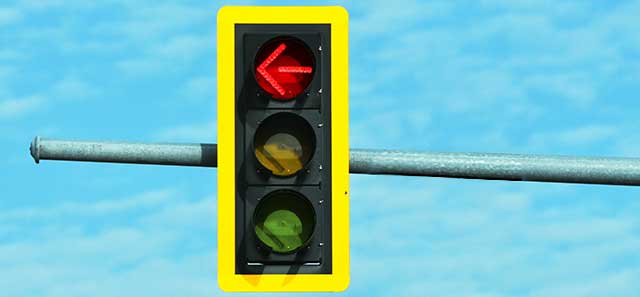 Traffic light with red arrow illuminated.