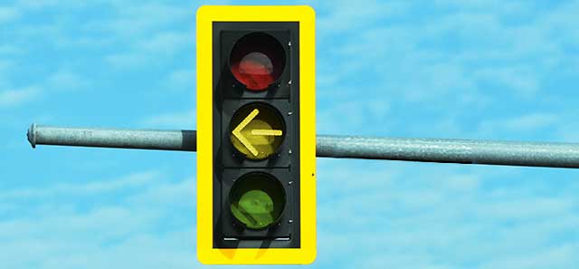 Traffic light with yellow arrow illuminated.