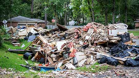 Large pile of debris from a destroyed home.